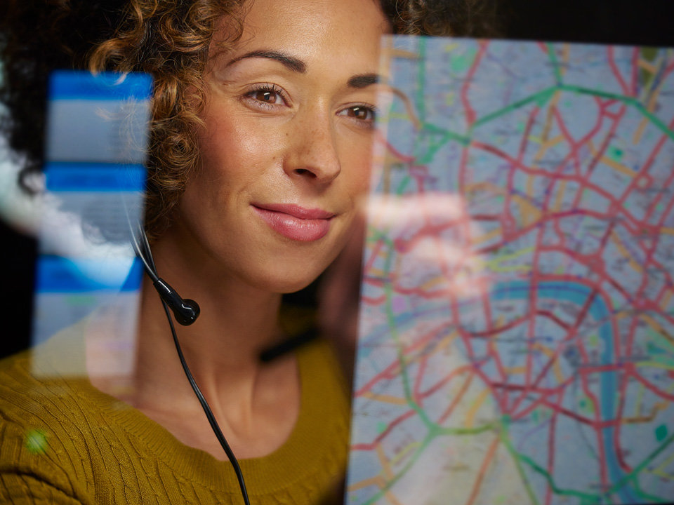 Smiling woman using headset